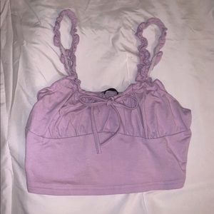 Has ruffled straps and a cute bow in the front